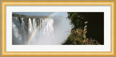 Framed Woman looking at a rainbow over the Victoria Falls, Zimbabwe Print