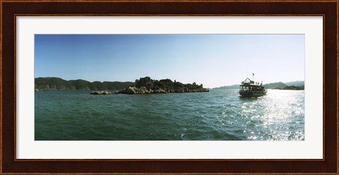 Framed Rocky island and boat in the Mediterranean sea, Sunken City, Kekova, Antalya Province, Turkey Print