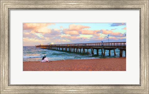 Framed Couple sitting on the beach at sunset, Fort Lauderdale, Florida, USA Print