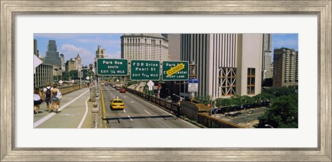 Framed Suspension bridge with buildings in a city, Brooklyn Bridge, New York City, New York State, USA Print