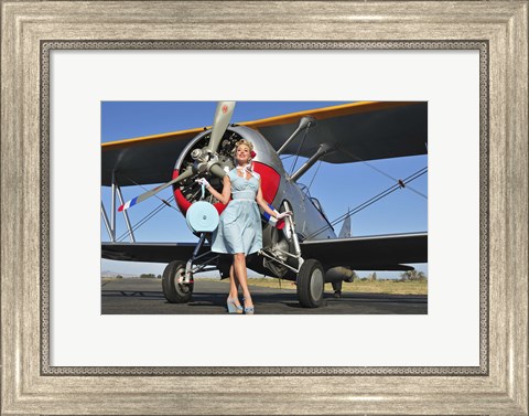Framed Elegant 1940&#39;s style pin-up girl standing in front of an F3F biplane Print