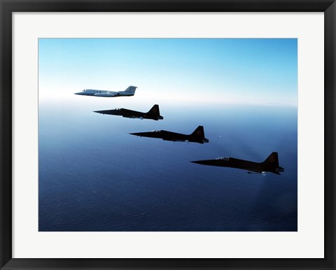 Framed Three F-5E Tiger IIs fly in formation with a Learjet 25 Print