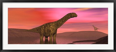 Framed Argentinosaurus dinosaurs amongst a colorful red sunset Print