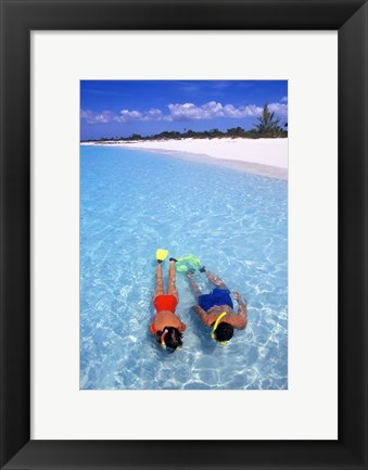 Framed Snorkeling in the blue waters of the Bahamas Print