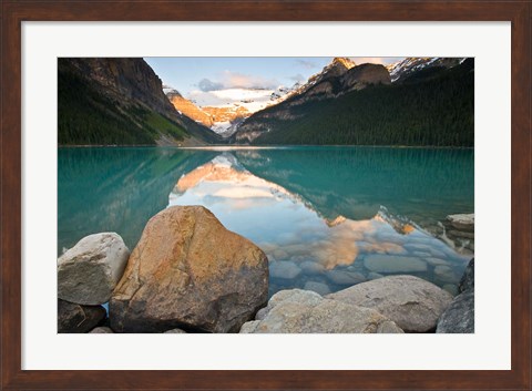 Framed Rocky Mountains and boulders reflected in Lake Louise, Banff National Park, Alberta, Canada Print
