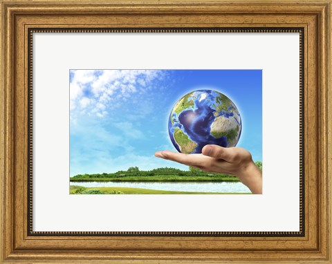 Framed Human Hand Holding Earth Globe with a Green Landscape Background Print
