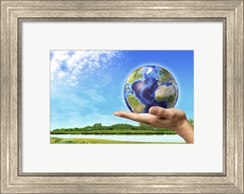 Framed Human Hand Holding Earth Globe with a Green Landscape Background Print