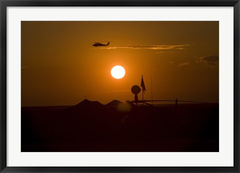 Framed UH-60 Blackhawk Flies Over Camp Speicher Airfield at Sunset Print