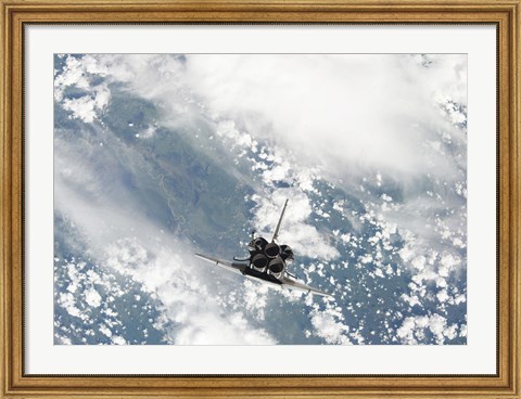 Framed Rear view of the Three main Engines of Space Shuttle Discovery as the Shuttle approaches the International Space Station Print