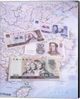 Close-up of yuan notes on a map Fine Art Print