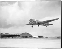 Low angle view of a military airplane landing, Douglas DC-3 Fine Art Print