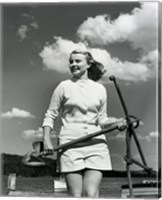 Young woman standing on boat, holding anchor Fine Art Print