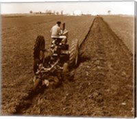 USA, Pennsylvania, Farmer on Tractor Plowing Field Fine Art Print