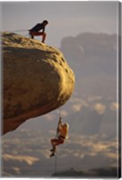 View of rock climbers on the edge of a cliff Fine Art Print