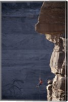 Man hanging from a rope on the edge of a cliff Fine Art Print