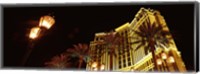 Low angle view of a hotel lit up at night, The Strip, Las Vegas, Nevada, USA Fine Art Print