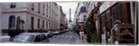 Buildings along a street with the Eiffel Tower in the background, Paris, France Fine Art Print