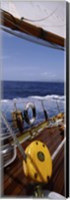 Detail of the mainsheet block of a wooden sailboat in the sea Fine Art Print