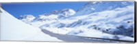Snow covered mountains on both sides of a road, St Moritz, Graubunden, Switzerland Fine Art Print