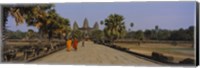 Two monks walking in front of an old temple, Angkor Wat, Siem Reap, Cambodia Fine Art Print