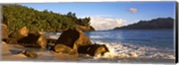 Waves splashing onto rocks on North Island with Silhouette Island in the background, Seychelles Fine Art Print