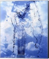 Slow motion geyser of water rising through blue sky and clouds Fine Art Print