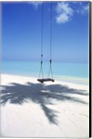 Swing on the beach above palm tree shadow Fine Art Print