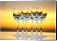 Row Of Wineglasses Against Golden Yellow shiny Background Fine Art Print