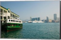 Star ferry on a pier with buildings in the background, Central District, Hong Kong Island, Hong Kong Fine Art Print