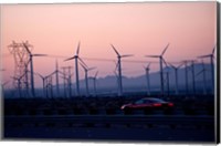 Car moving on a road with wind turbines in background at dusk, Palm Springs, Riverside County, California, USA Fine Art Print