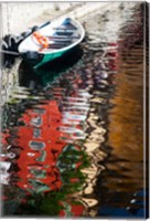 Houses and boat reflected in Lake Como, Varenna, Lombardy, Italy Fine Art Print