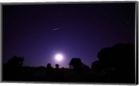 A bolide from the Geminids meteor shower above a setting moon in Mercedes, Argentina Fine Art Print