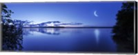Moon rising over tranquil lake against moody sky, Mozhaisk, Russia Fine Art Print