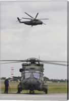 A German Army NH90 and its Predecessor, the CH-53 Sea Stallion Fine Art Print