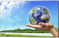 Human Hand Holding Earth Globe with a Green Landscape Background Fine Art Print