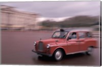 Cab racing past Buckingham Palace, London, England Fine Art Print