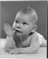 1950s Baby Lying On Stomach With Thumb In Mouth Fine Art Print