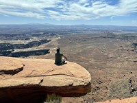 Adult Male Sitting on the Edge Of a Stunning Viewpoint Fine Art Print