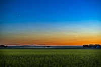 The Waxing Crescent Moon Below Venus Over a Ripening Canola Field Fine Art Print