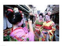 Three geishas, Kyoto, Honshu, Japan (taking pictures) Fine Art Print