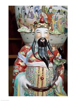 Statue of a snake charmer holding a snake Fine Art Print