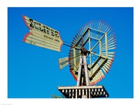 Low angle view of an industrial windmill Fine Art Print