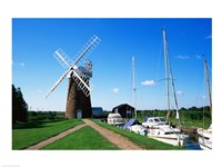 Boat moored near a traditional windmill, River Ant, Norfolk Broads, Norfolk, England Fine Art Print
