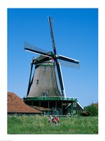 Windmill and Cyclists, Zaanse Schans, Netherlands Fine Art Print