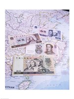 Close-up of yuan notes on a map Fine Art Print