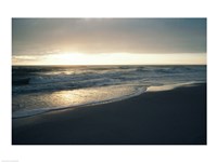 Waves breaking on the beach at sunrise Fine Art Print