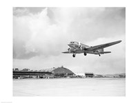 Low angle view of a military airplane landing, Douglas DC-3 Fine Art Print