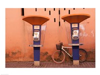 Public telephone booths in front of a wall, Morocco Fine Art Print