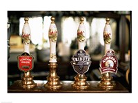 Close-up of beer tap handles in a bar, London, England Fine Art Print