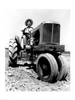 Farmer Sitting on a Tractor in a Field Fine Art Print